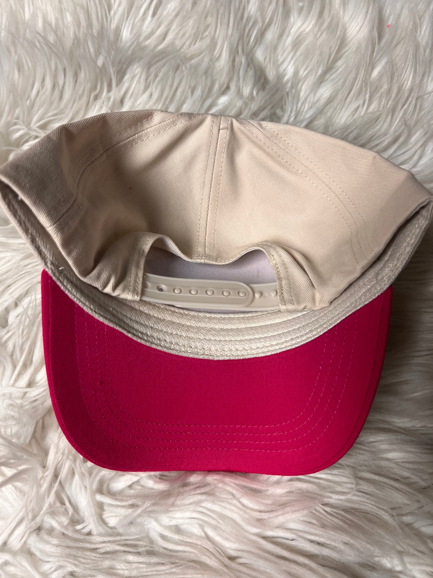 New pink hat a little on the trash side 