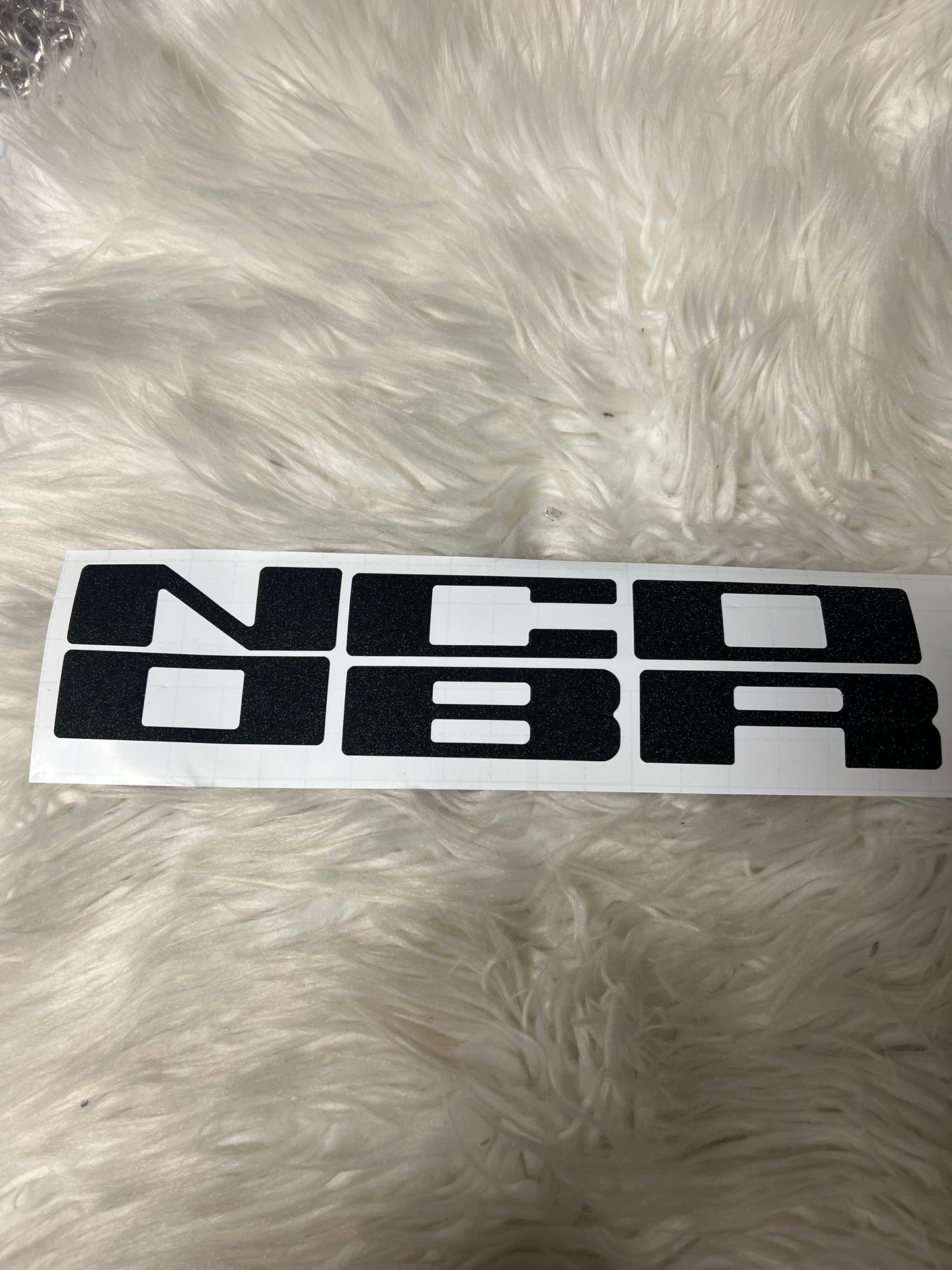 New car decals the letters on the grill