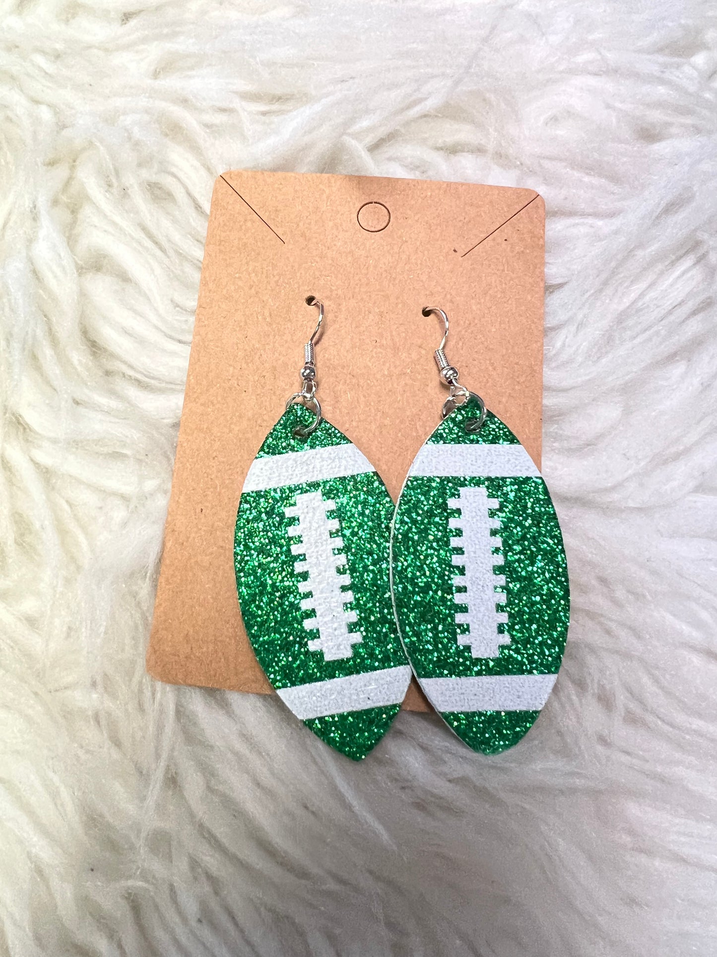 New glitter, faux, leather football earrings green