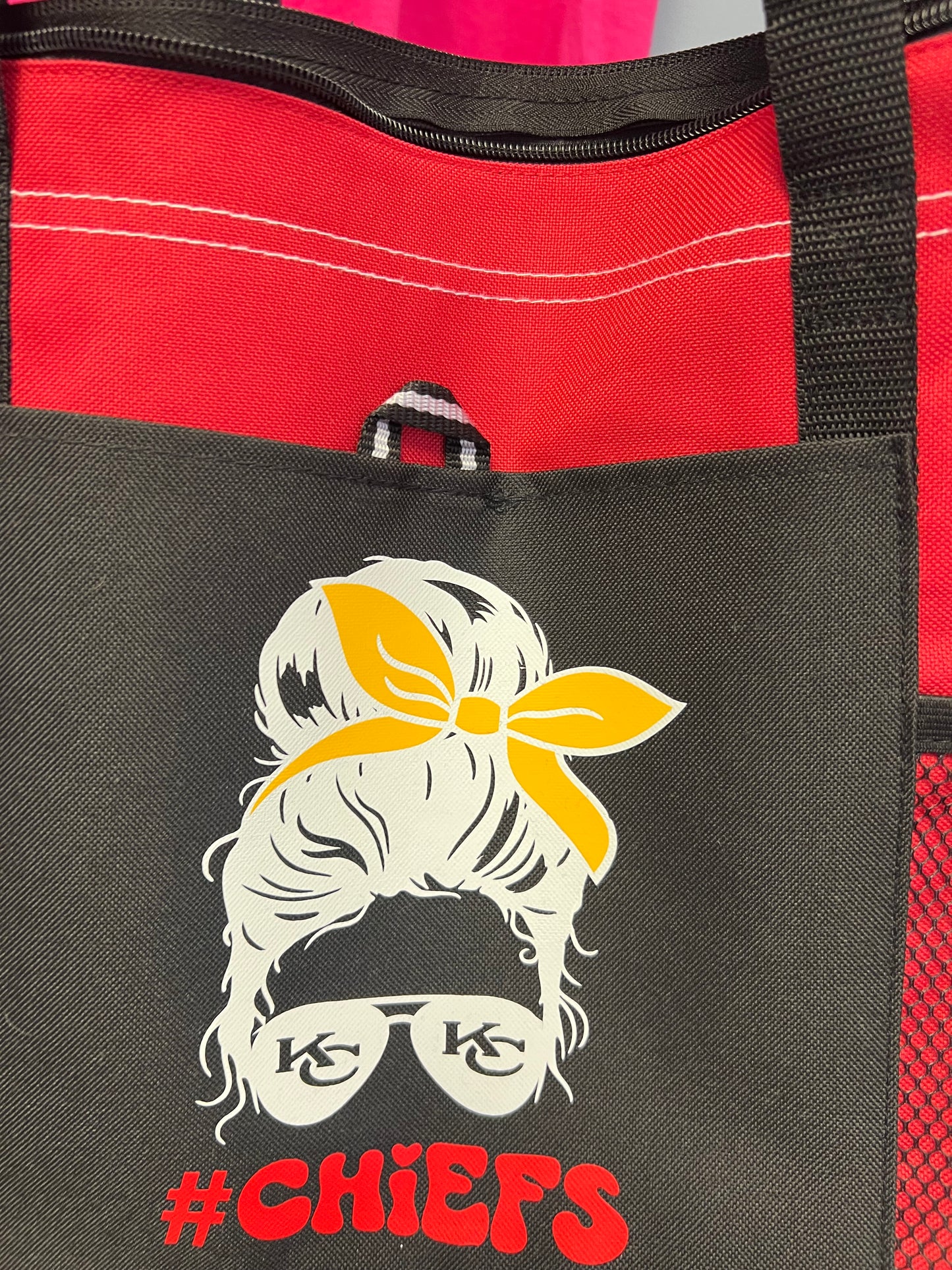 New red tote messy bun of football