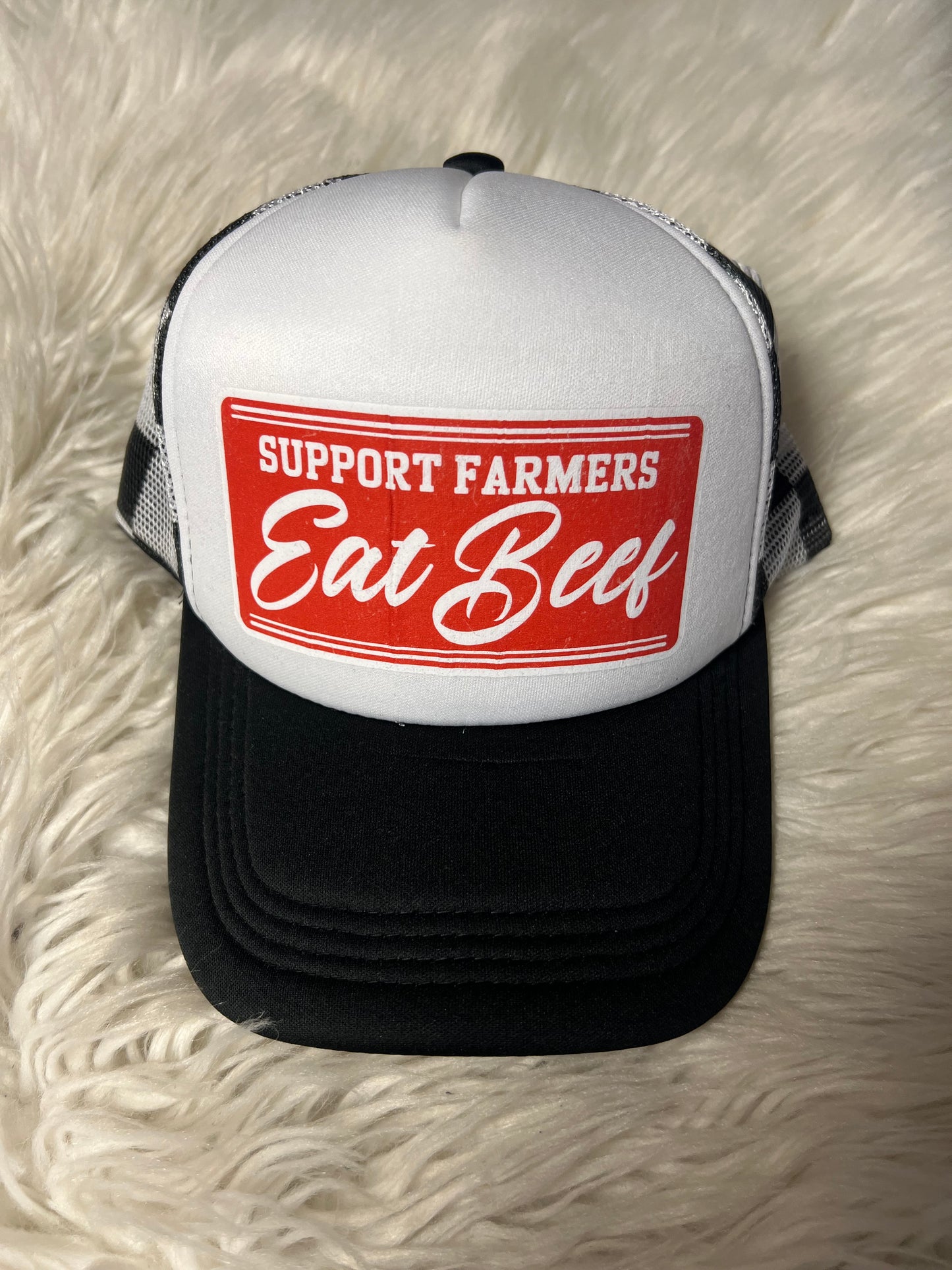 New hat support, farmers eat beef ￼